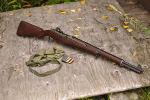 An M1 Garand rifle with sling, and ammo