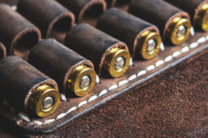 Rounds of ammo are held in a belt with ammo loops.