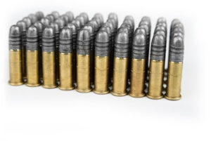 50 22 long rifle bullets, arranged standing straight up in a rectangle.