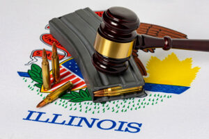 The seal of the state of Illinois is covered by rounds of ammunition, a firearm magazine, and a gavel