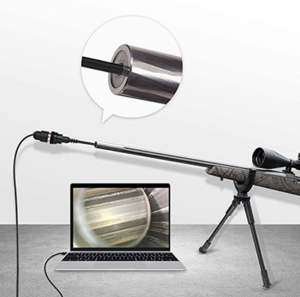 A long weapon with a camera in the barrel, which is sending a picture of the barrel via cable to a laptop computer