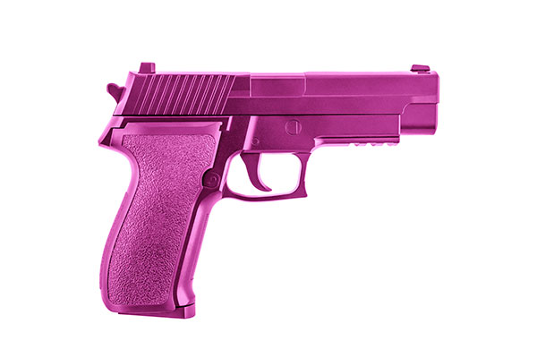 Side view of an automatic pistol that's been painted entirely pink.