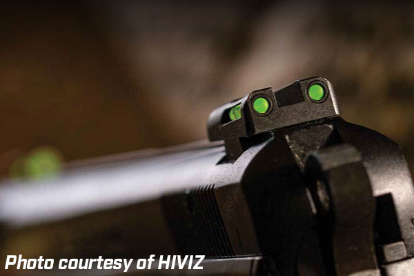 Closeup on a HIVIZ fiber optic pistol sight at end of barrel.