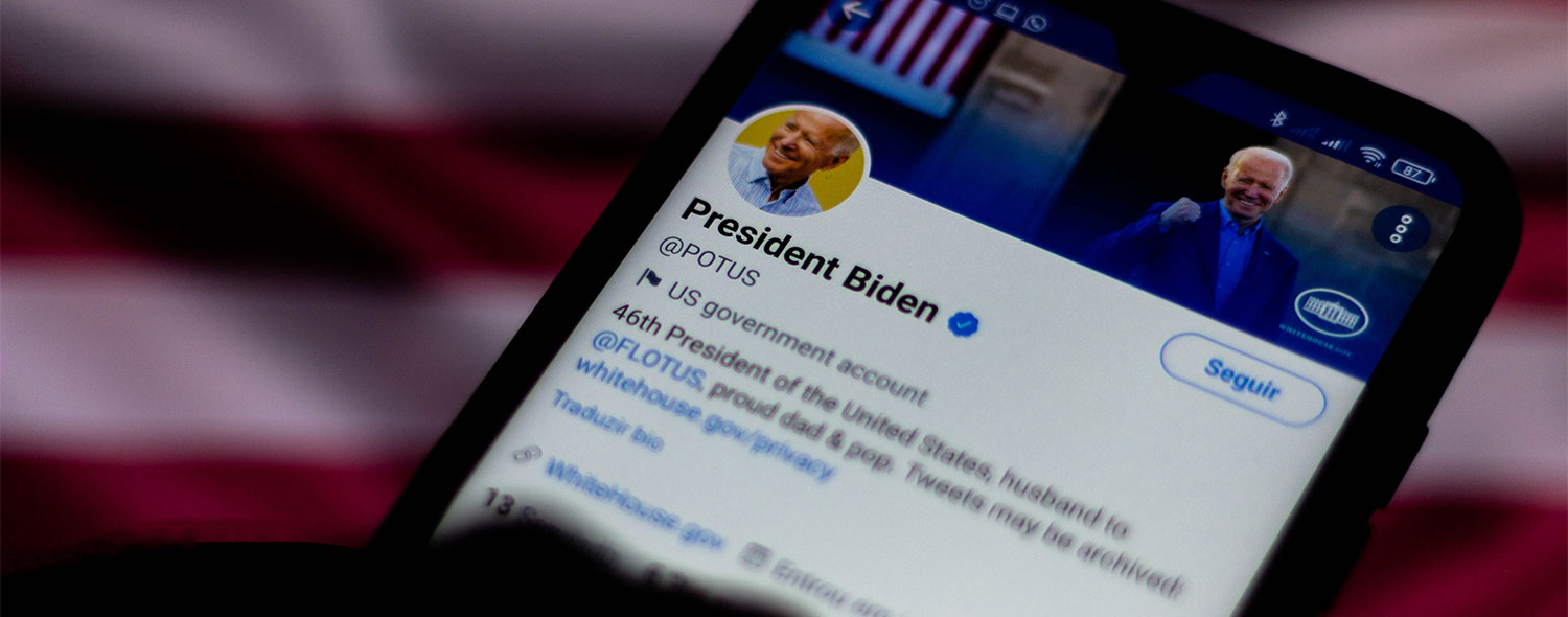 A cell phone showing President Biden's Twitter page