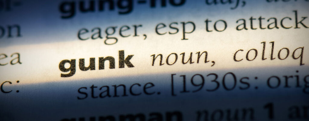 Dictionary listing for the word "gunk" which describes the messy nature of cosmoline
